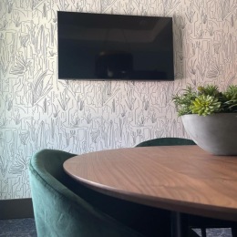 The essence of exceptional living A room with a table and a TV